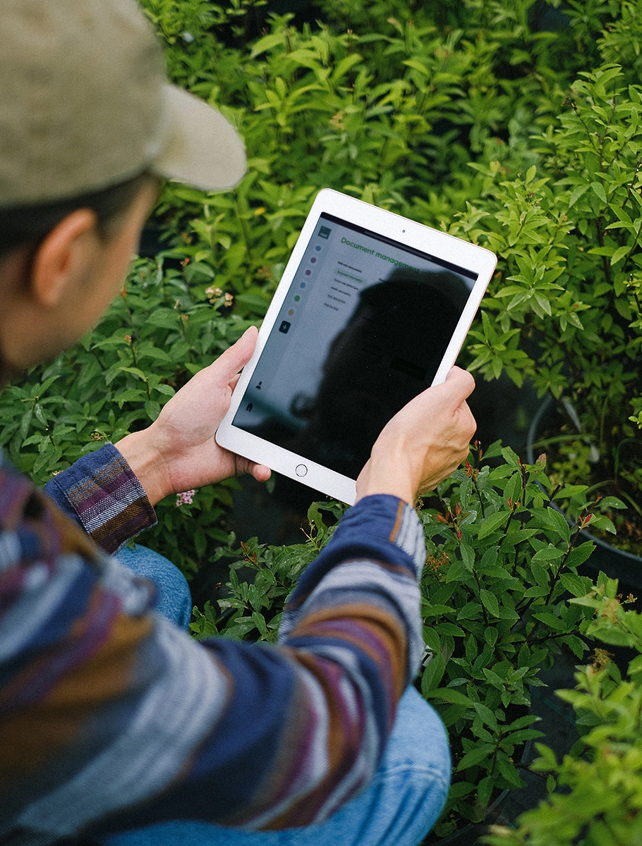 image - Farmer Recording Data Into Tablet